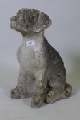 A vintage concrete garden figure of a seated dog, 20" high, one paw AF