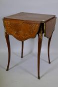 A C19th inlaid rosewood and tulipwood side table with four shaped flaps, with brass edges and