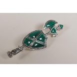 A Scottish style silver and malachite brooch in the form of an axe and shield, 2" long