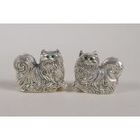 A pair of silver plated condiments in the form of long haired cats, marked 800