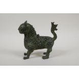 An Indo Persian pierced bronze lion censer, 7" long, 6½" high