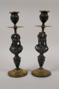 A pair of antique bronze and brass candlesticks with figural bust decoration of a lady, 9½" high