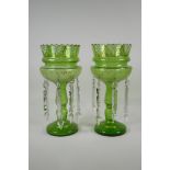 A pair of Bohemian green glass lustres, with gilt & enamel decoration, 1 drop missing, AF, 13½" high