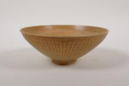 A Chinese song style pottery dish with a thin celadon glaze and incised decorative pattern, 6"