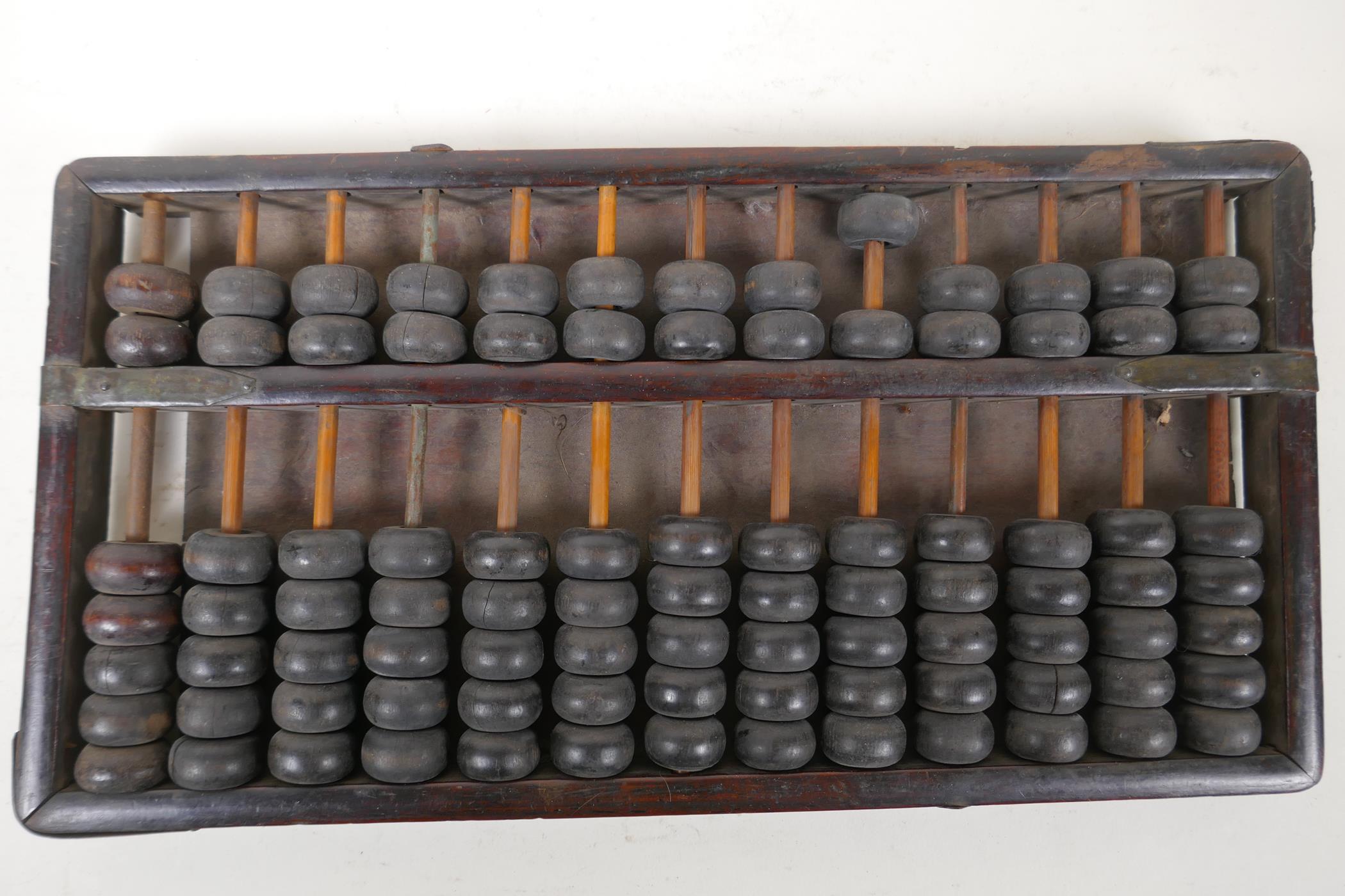 A Chinese wooden abacus, AF, 12" x 6"