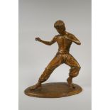 A bronze figure of Bruce Lee, 13½" high