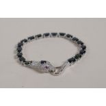 A 925 silver and sapphire bracelet with a snake head clasp encrusted with cubic zirconia, 6½" long