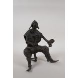 An African Benin bronze of a drummer, 8½" high