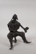 An African Benin bronze of a drummer, 8½" high