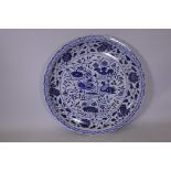 A large Chinese ceramic charger with blue and white decoration and lobed edge, 37" diameter