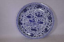 A large Chinese ceramic charger with blue and white decoration and lobed edge, 37" diameter