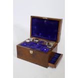 A C19th walnut vanity box, with fitted interior and mirror and side drawer, 11" x 8" x 7"