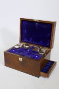 A C19th walnut vanity box, with fitted interior and mirror and side drawer, 11" x 8" x 7"