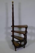 A set of mahogany library steps with brass mount and leather inset steps, 44" high, 17" wide