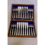 A Rodgers silver plated 12 place fish knife and fork service, in oak canteen