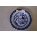 A C19th Chinese blue and white dish, decorated with pagodas in a landscape, 9" diameter