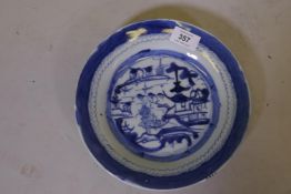A C19th Chinese blue and white dish, decorated with pagodas in a landscape, 9" diameter