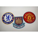 Three painted cast iron football club plaques, 9½" diameter