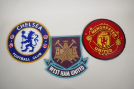 Three painted cast iron football club plaques, 9½" diameter