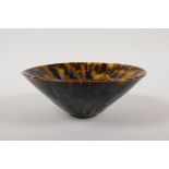 A Chinese Cizhou kiln conical bowl with a tortoise shell glaze, 6½" diameter