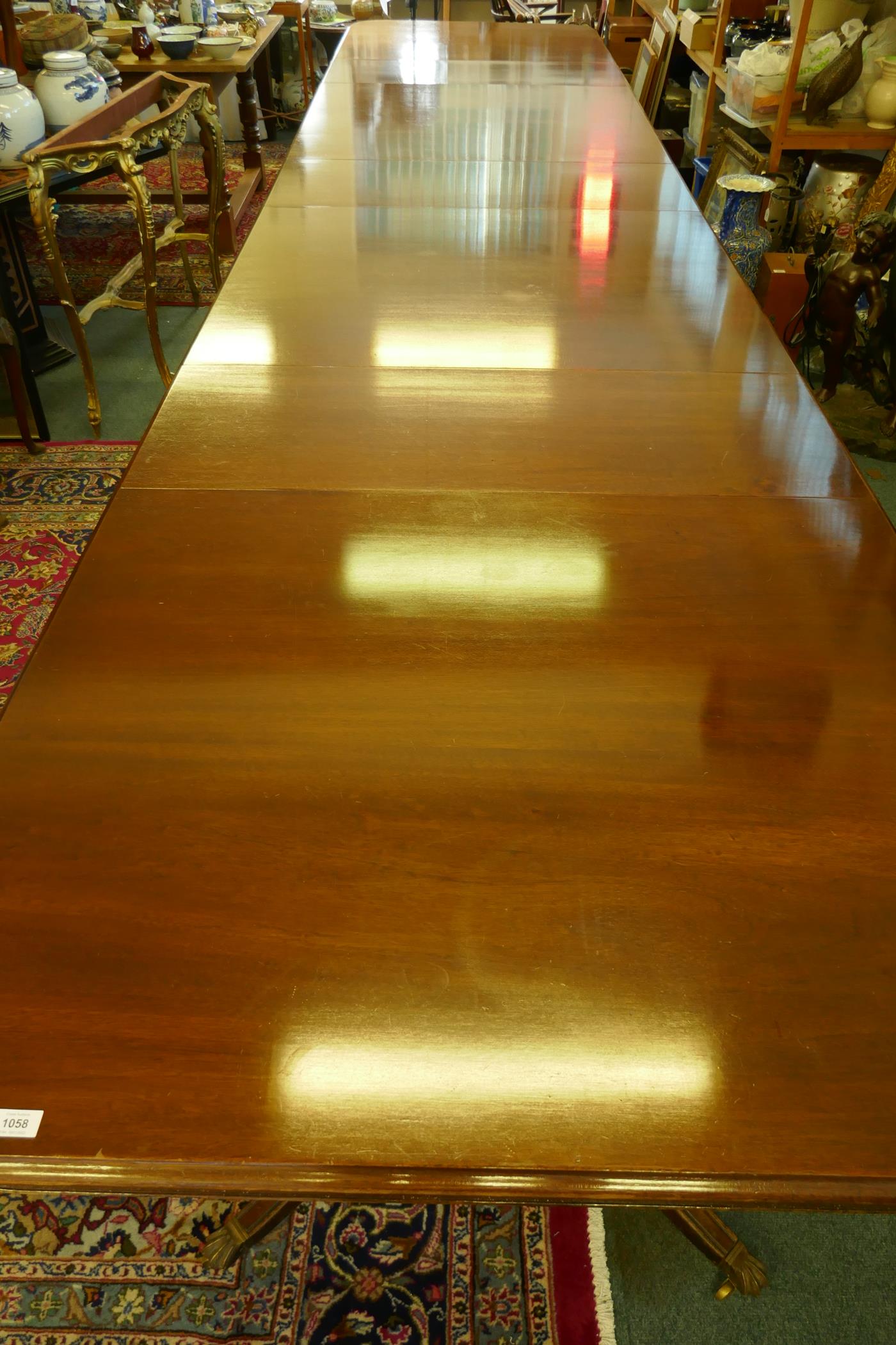 A Regency style mahogany four pedestal dining table with three extra leaves, the solid top with - Image 4 of 9