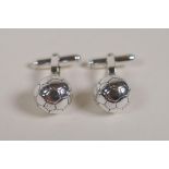 A pair of 925 silver football cufflinks