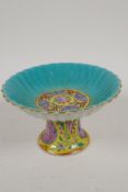 A Chinese porcelain stem bowl painted in bright enamels, 6 character mark to base, 6" diameter