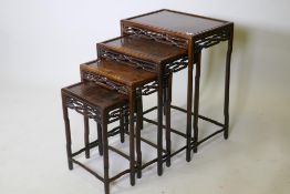 A Chinese quartetto of hardwood occasional tables, with carved and pierced friezes, raised on shaped