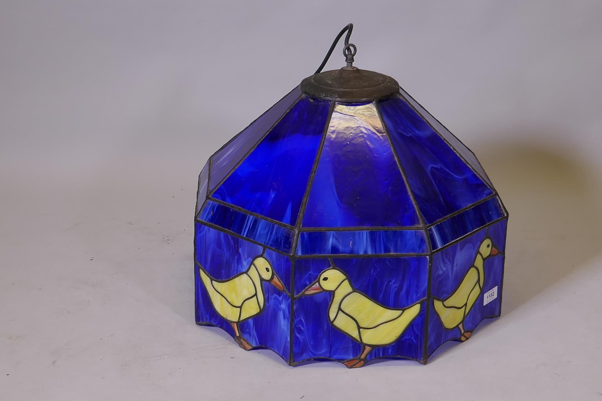 A glass ceiling lamp shade with duck motif decoration, 20" diameter, 17" high