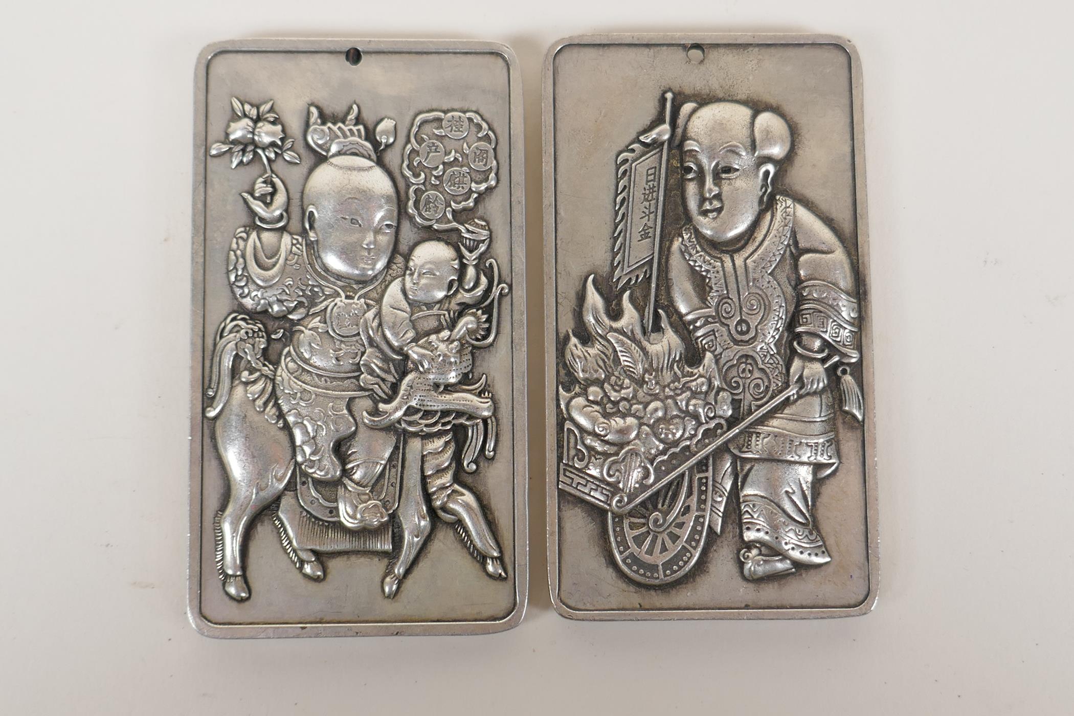 A pair of Chinese white metal scroll weights with figural decoration, 2" x 3½" - Image 2 of 2