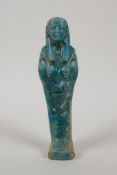 An Egyptian turquoise glazed faience shabti, 6½" high