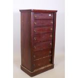 A C19th mahogany seven drawer Wellington chest, with brass ring handles, raised on a plinth base,