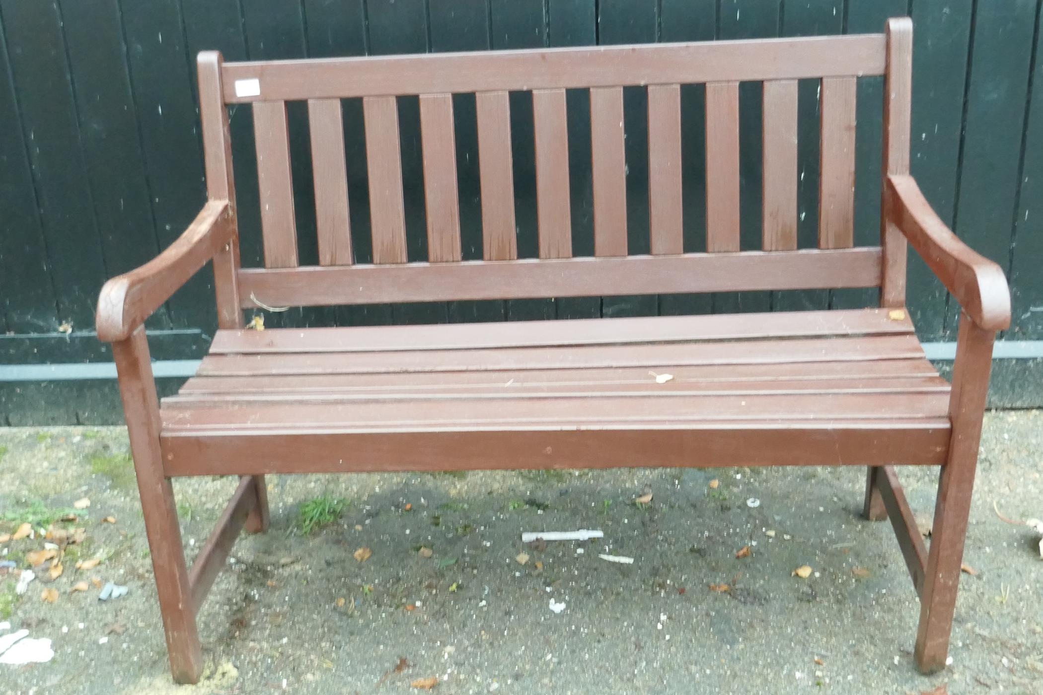 A stained and varnished teak garden bench, 47" long