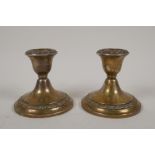 A pair of dwarf sterling silver candlesticks by Gorham Silver in Providence, Rhode Island, 3" high