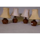 A set of four mid century teak table lamps, 8" high