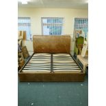 A leather upholstered double bed, 74" x 46" x 90"
