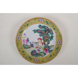 A Chinese polychrome porcelain dish decorated with a western lady and her baby, 4 character mark