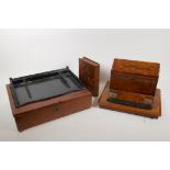 A Victorian inlaid walnut desk stand, together with an ebony desk stand, a leather covered