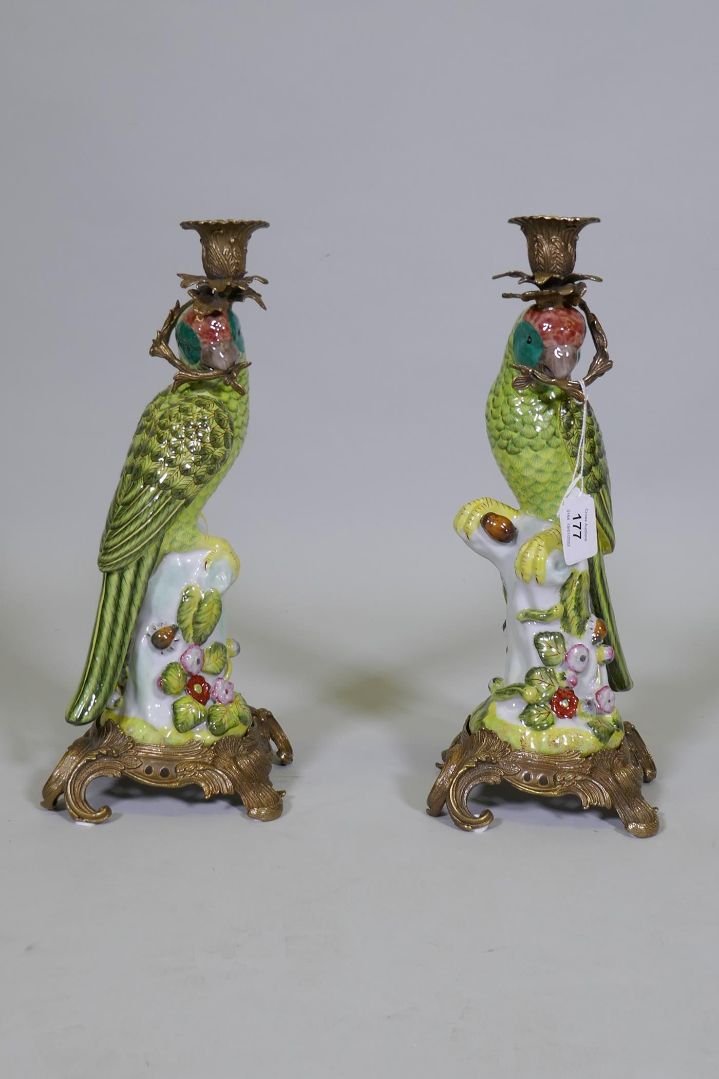 A pair of porcelain parrot candlesticks with brass mounts, decorated in bright enamels, marked to - Image 3 of 8