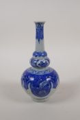 A blue and white porcelain slender necked vase, marked to base, 7" high