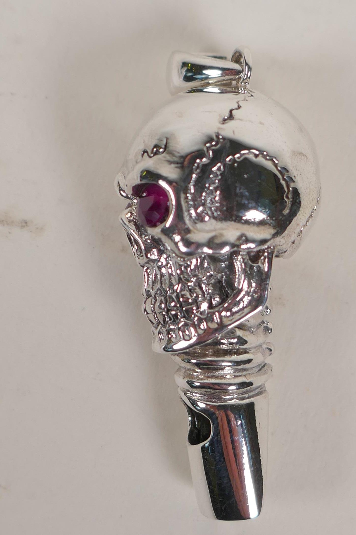 A sterling silver whistle modelled as a skull with ruby eyes - Image 2 of 4