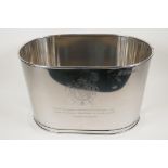 A plated oval wine cooler, engraved with aphorisms from Lilly Bollinger and Napolean Bonaparte,