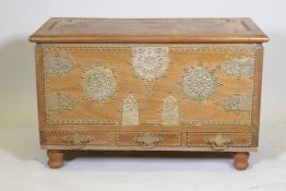 A Zanzibar style teak chest with brass mounts and three drawers, 38" x 19" x 24"