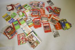 A collection of Arsenal Football Club programmes dating from the late 1950s to 90s, including some