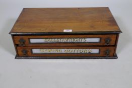 A Bagley & Wright's sewing cottons antique walnut shop display case, with two drawers and eglomise