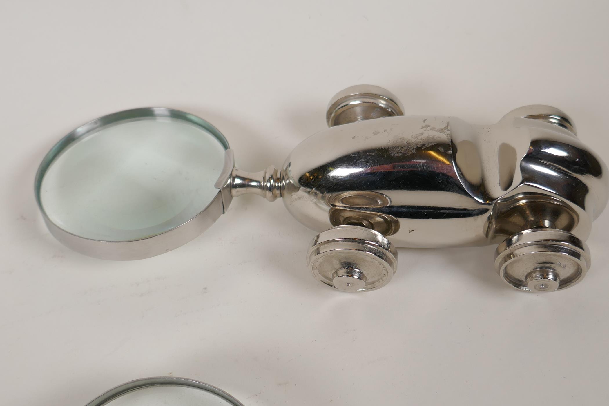 Two plated desk top magnifying glasses in the form of a racing car and an aeroplane, 9" long - Image 2 of 3