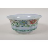 A Doucai porcelain bowl, decorated with a dragon and phoenix chasing the flaming pearl, Chinese