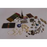 A vintage Gucci lady's leather purse, 3½" x 7", and a quantity of vintage costume jewellery with