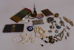 A vintage Gucci lady's leather purse, 3½" x 7", and a quantity of vintage costume jewellery with