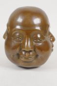 A bronze four faced Buddha head, 5" high